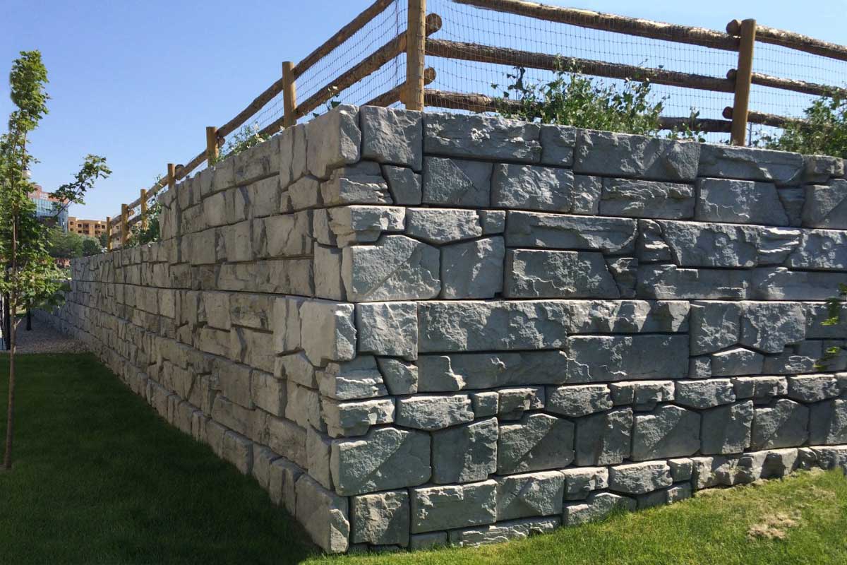 Retaining wall with fence on top